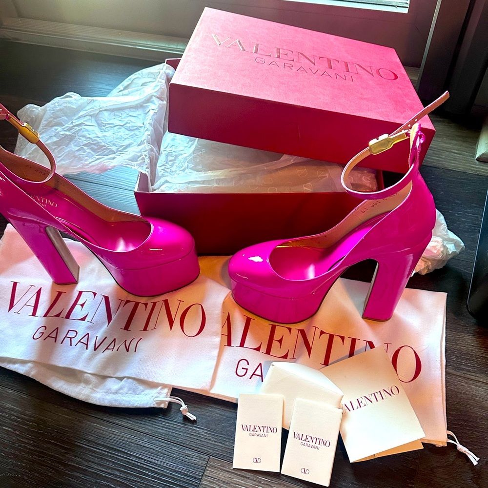 Worn one time for an hour. Platform heel , hot pink patent leather shoe.